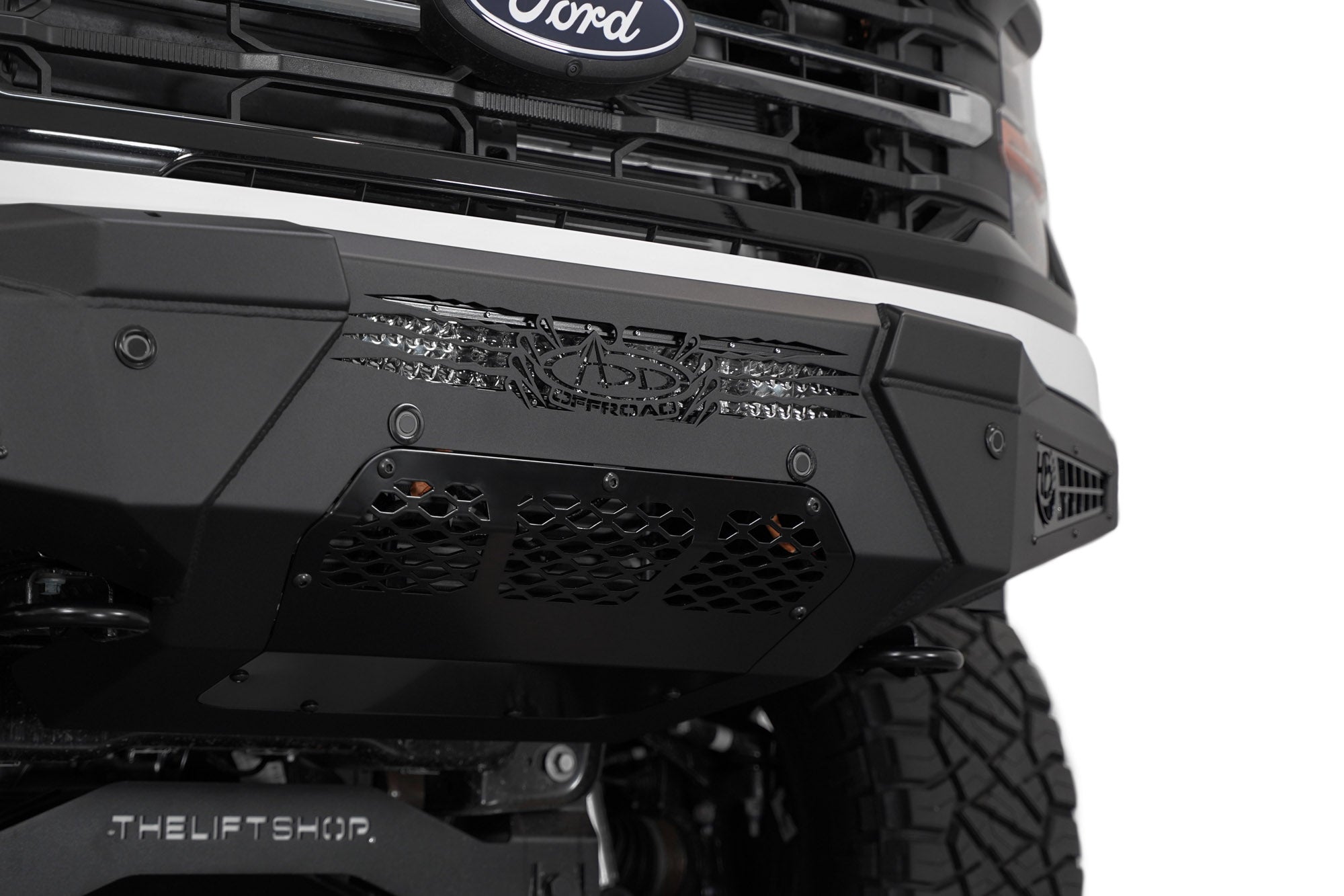 Up-close front view of the low-profile 2024 Ford F-150 HoneyBadger Front Bumper