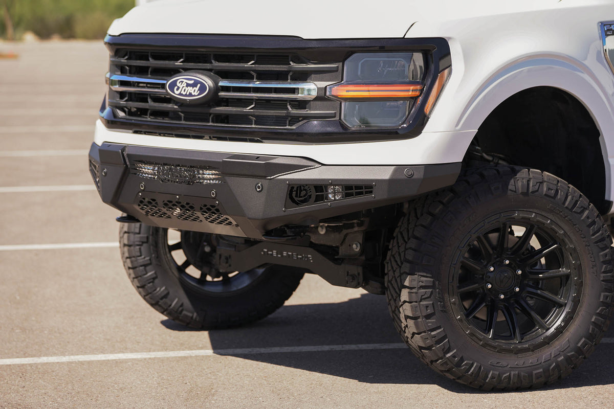 Side profile of the 2024 Ford F-150 HoneyBadger Front Bumper outdoors